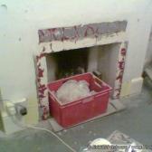 The old fireplace comes out